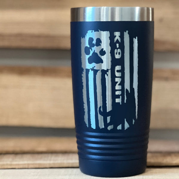 Navy blue tumbler with K-9 Unit design on a wooden surface